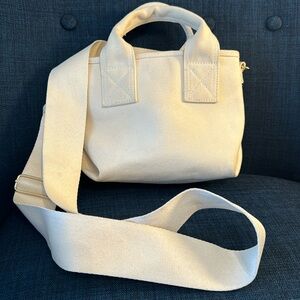 Cream Canvas H&M adjustable cross body convertible purse. Price is negotiable.